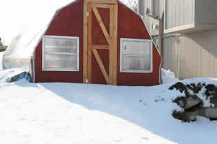 Snow covered greenhouse